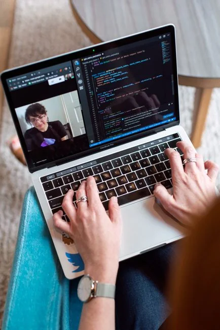 A modern computer screen displaying web design work, showcasing creative visuals in a workspace.
